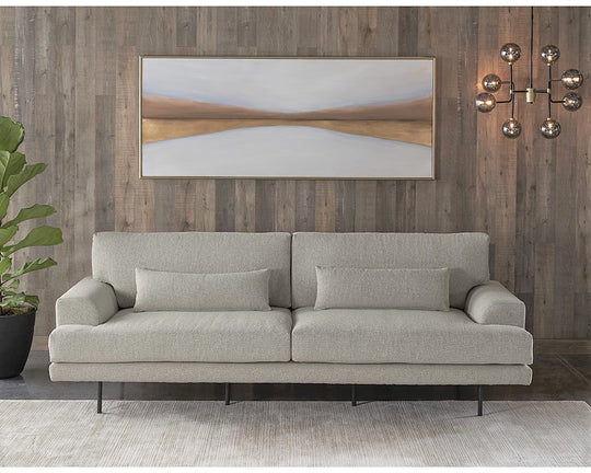 This finely crafted sofa offers exceptional comfort and a sleek, modern design. Its elegant black-finished iron feet enhance its timeless esthetic. Available in sophisticated Almond beige or luxurious Charcoal gray fabric options to match your personal style.